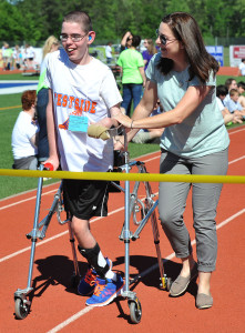 Physical therapist Jenna McMasters assists Westside Junior High athlete Andrew Ingrahm at the Special Olympics’ Florida Parishes Area Track & Field Meet. Photo courtesy of The Advocate, by Photographer David Normand.